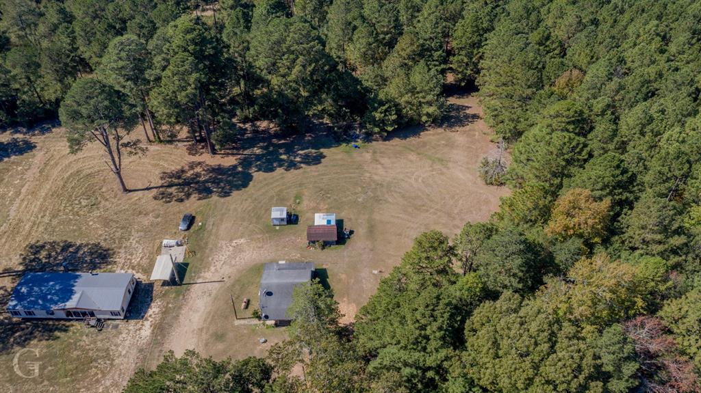 an aerial view of residential house with outdoor space