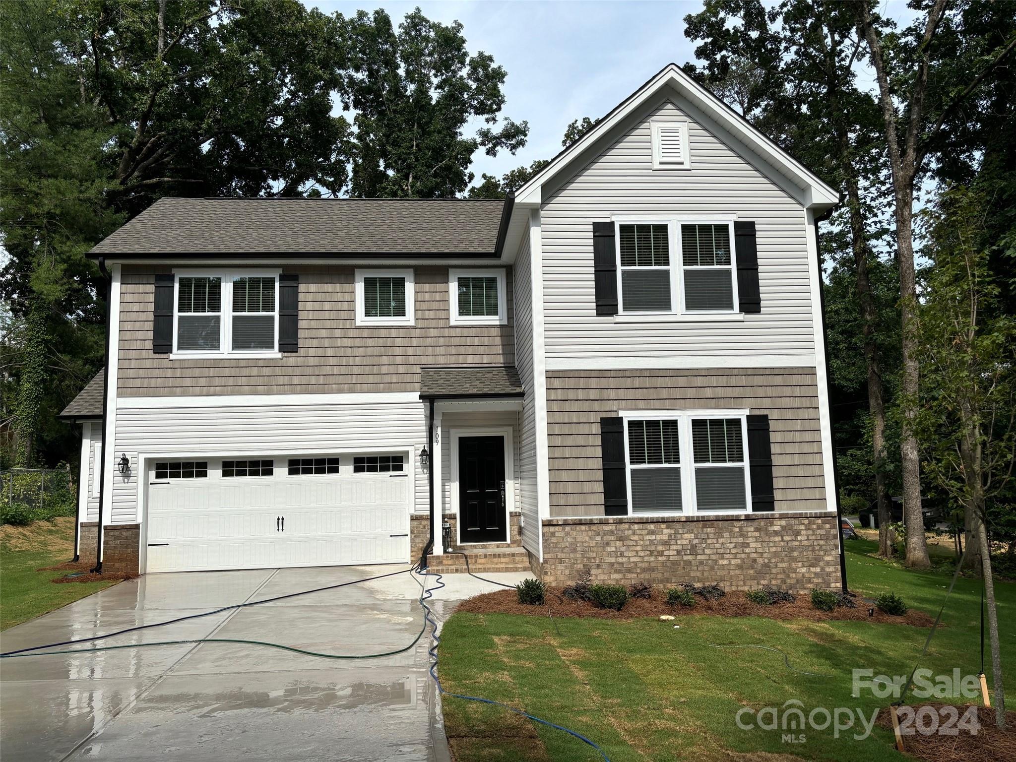 a front view of a house with a yard