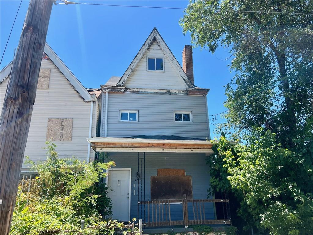 a view of a house with a tree