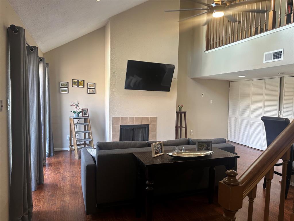 a view of a livingroom with furniture and a flat screen tv