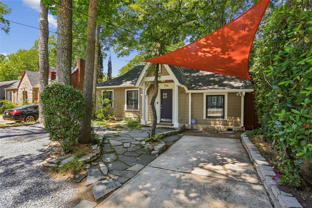 a front view of a house with garden