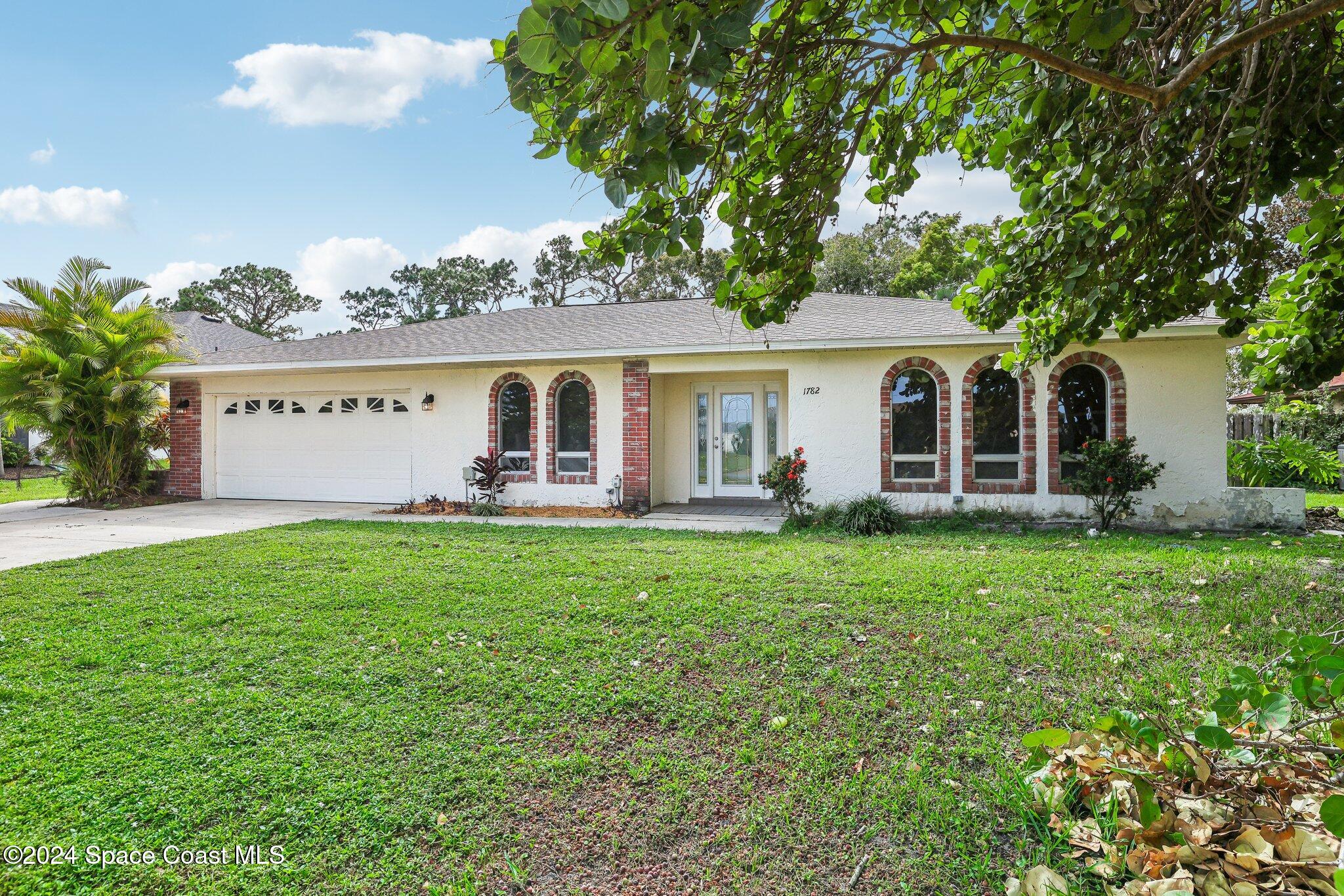 front view of a house with a yard