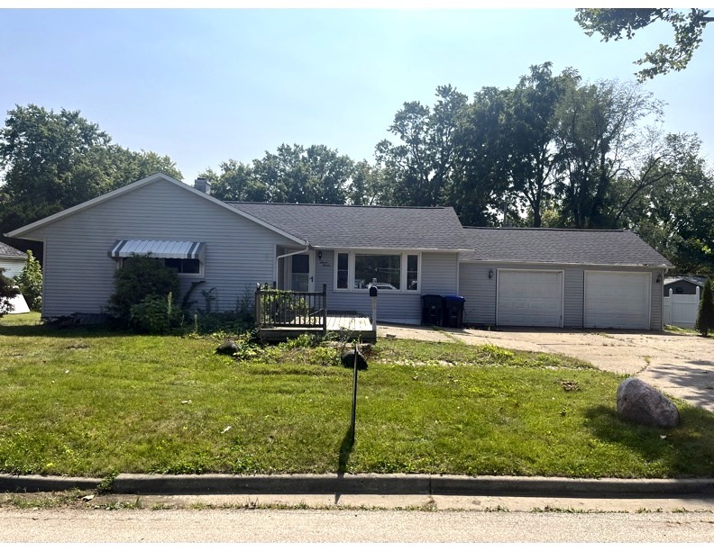 a front view of house with yard and seating area