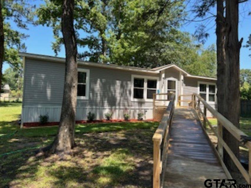 a front view of a house with yard