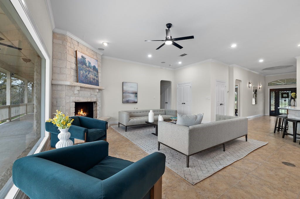 a living room with furniture and a fireplace