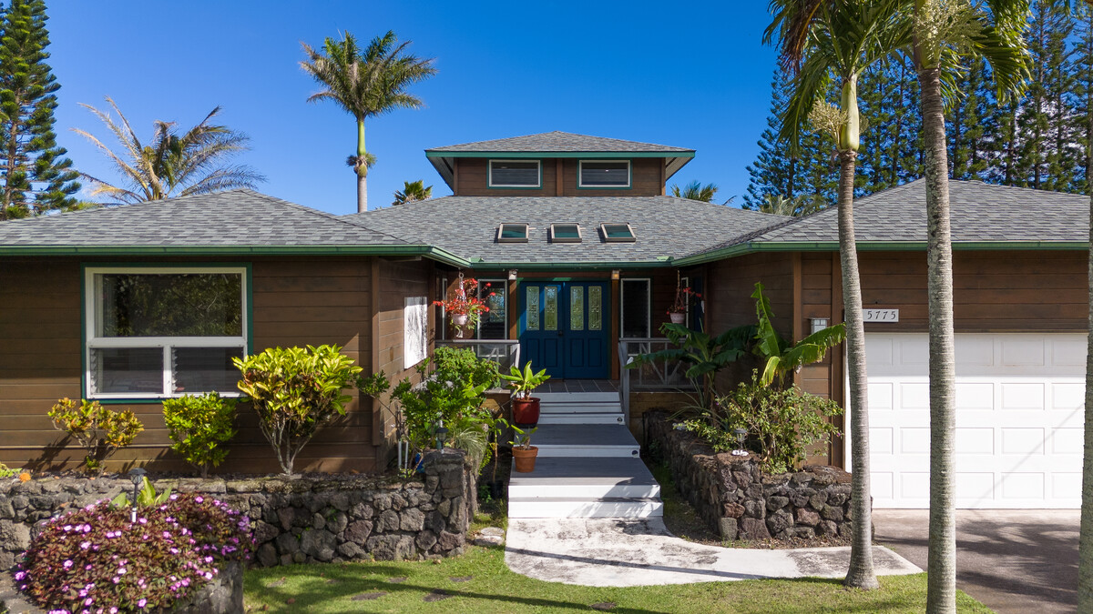 a front view of a house with a porch