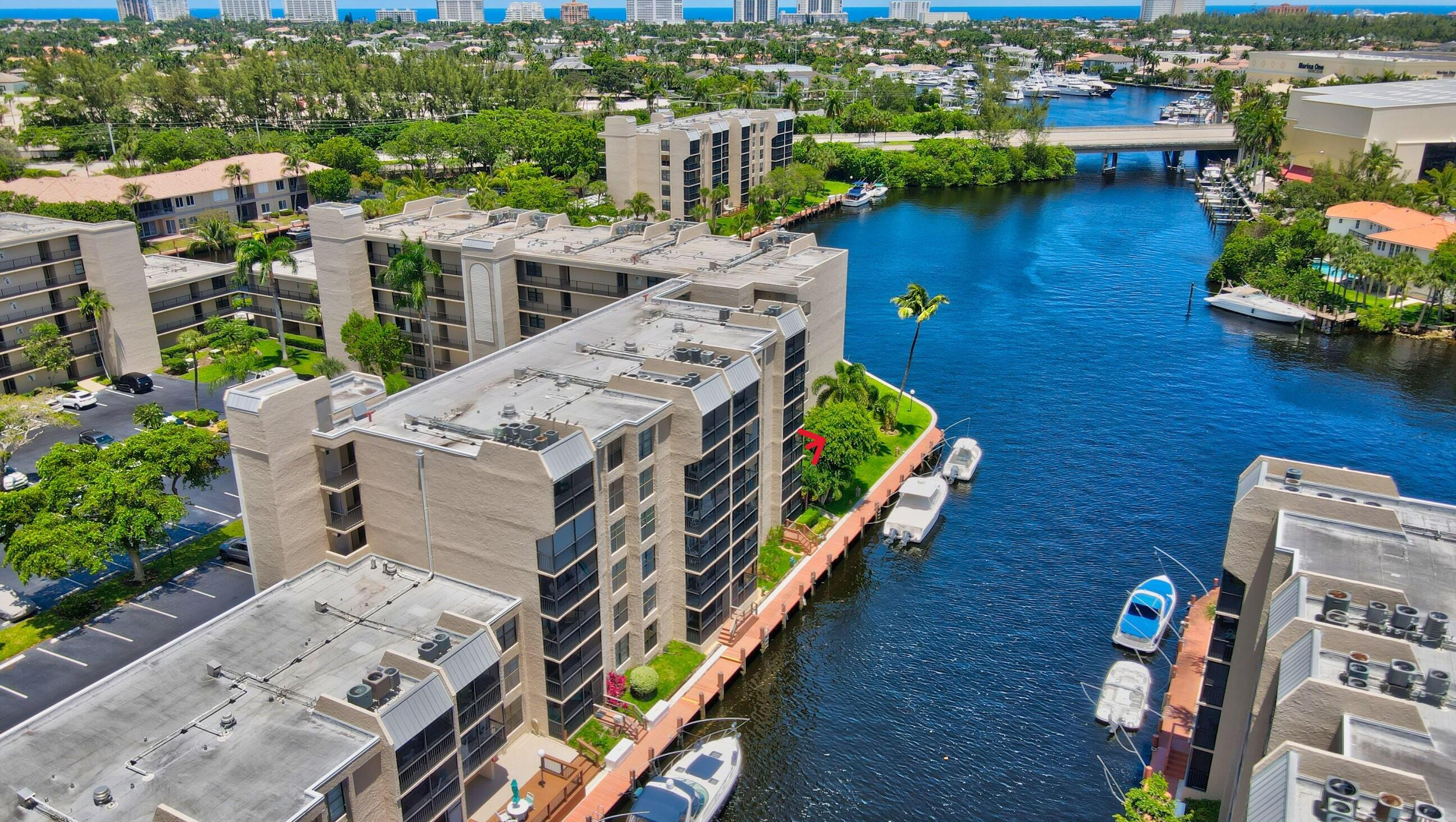 aerial view of a house with outdoor space and lake view