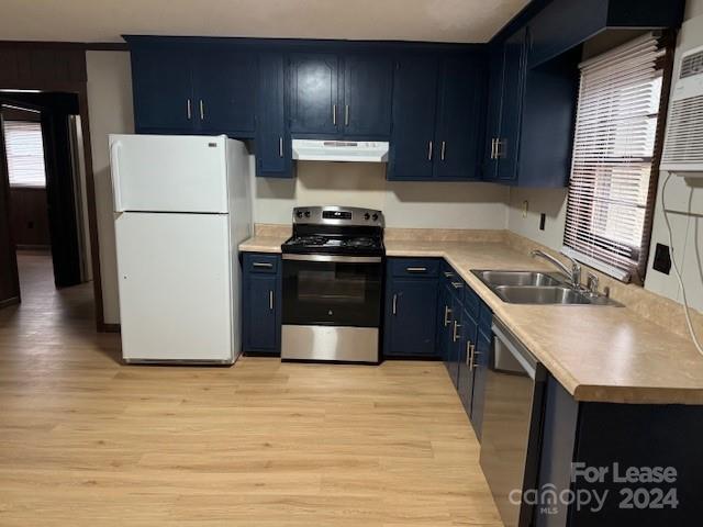 a kitchen with a refrigerator and a sink