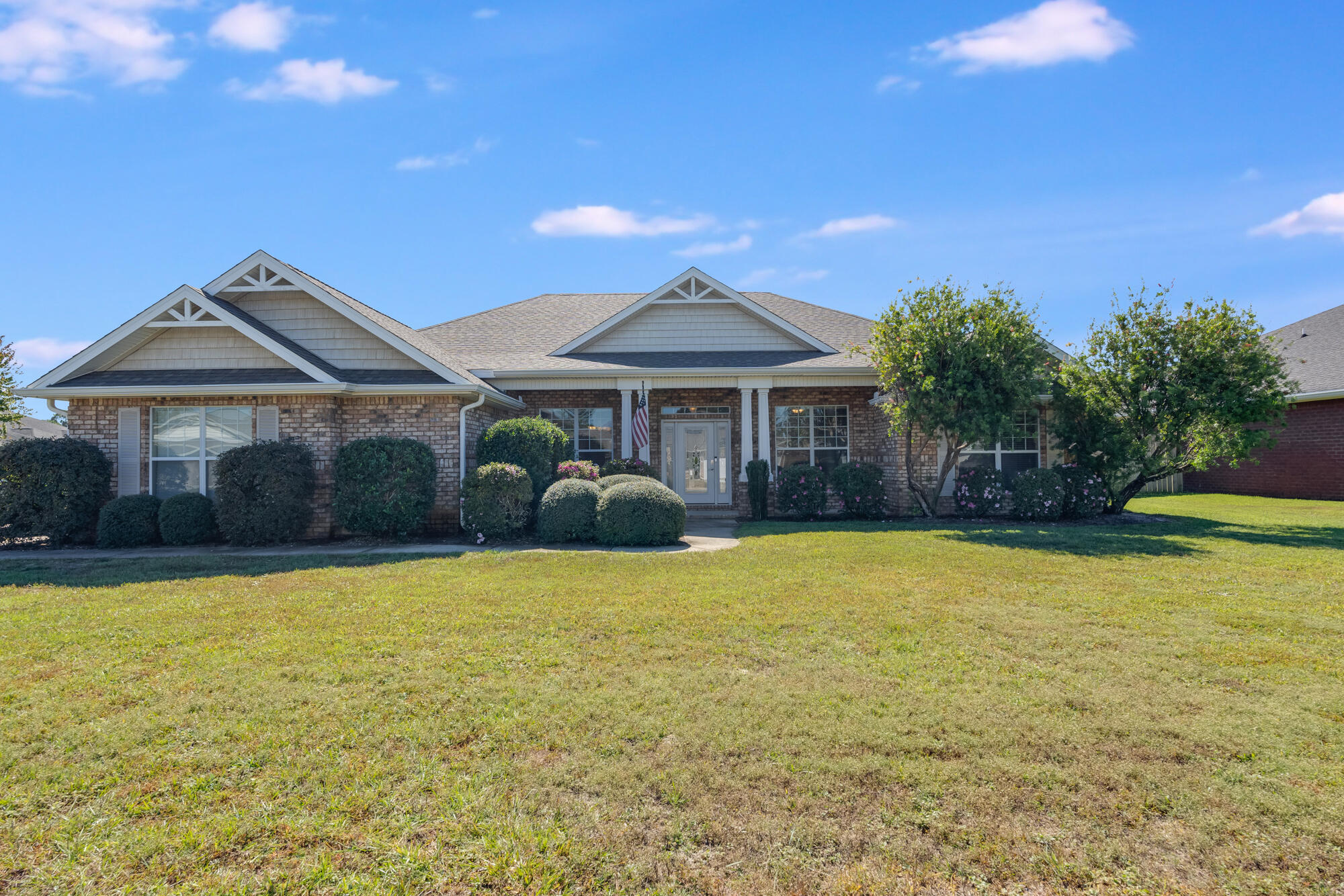 a front view of a house with a yard