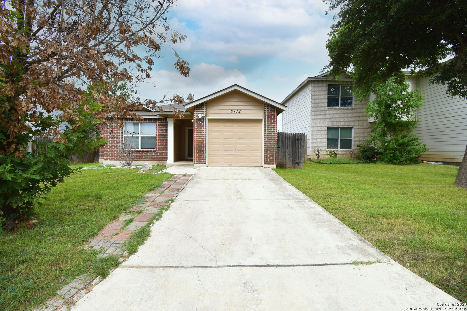 a front view of a house with yard