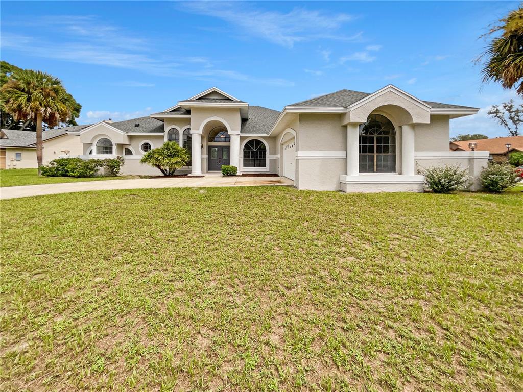 a view of a house with a yard