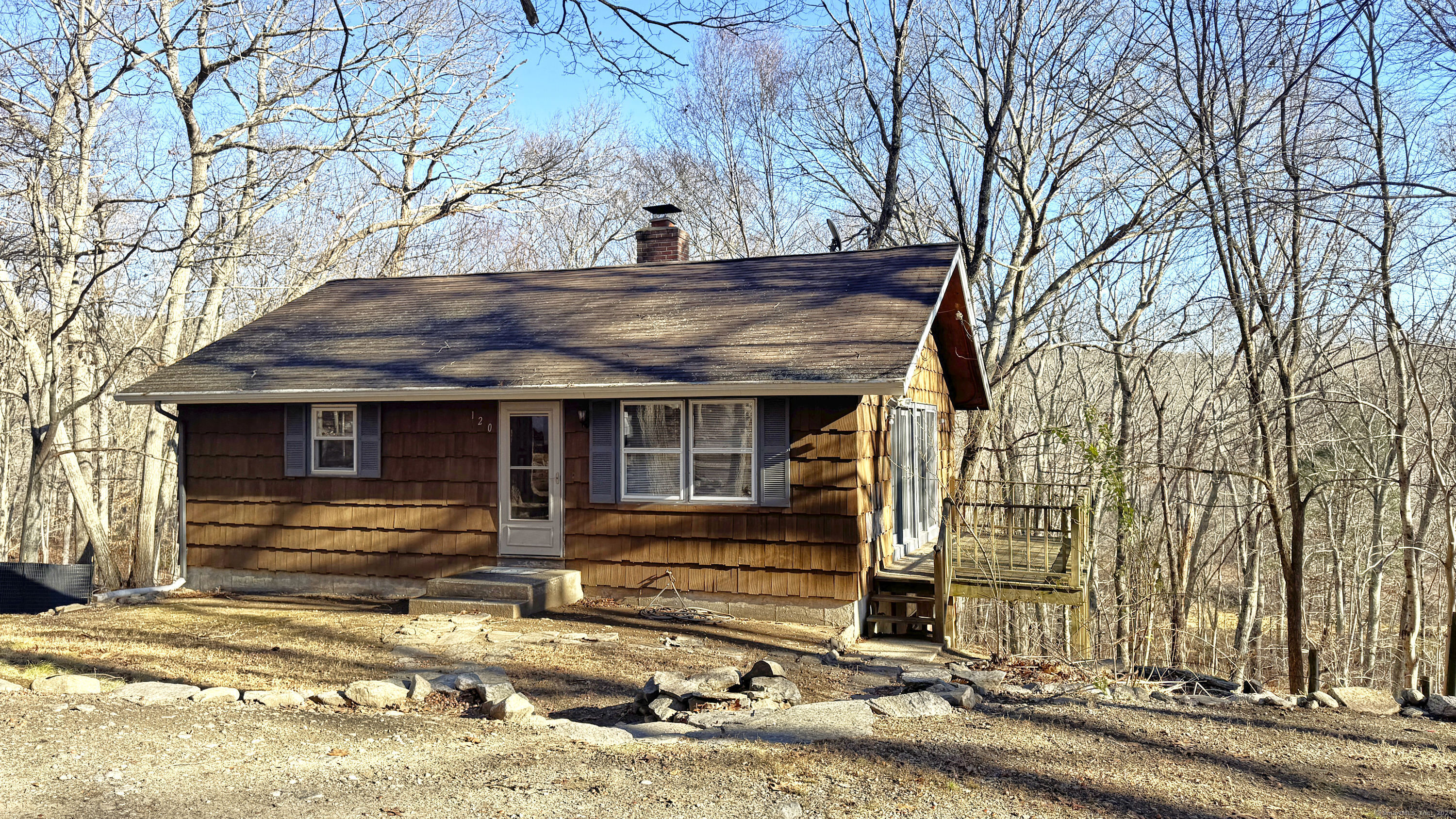 a view of a house with large trees