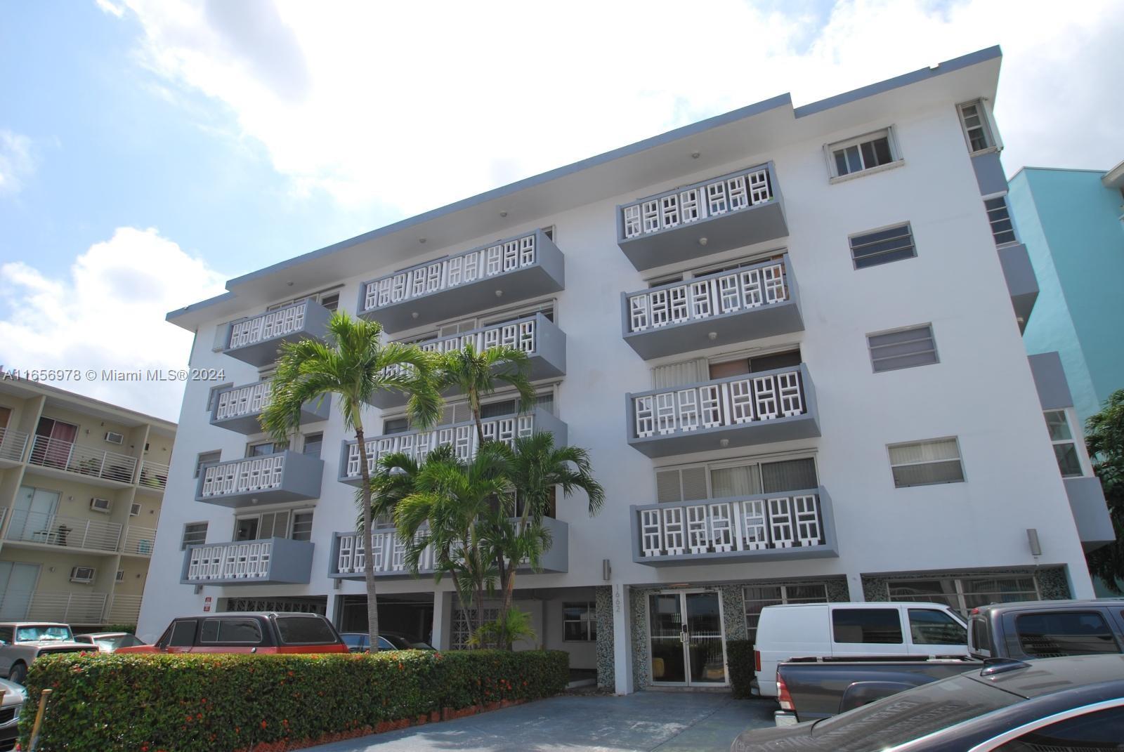 a front view of a building with garden