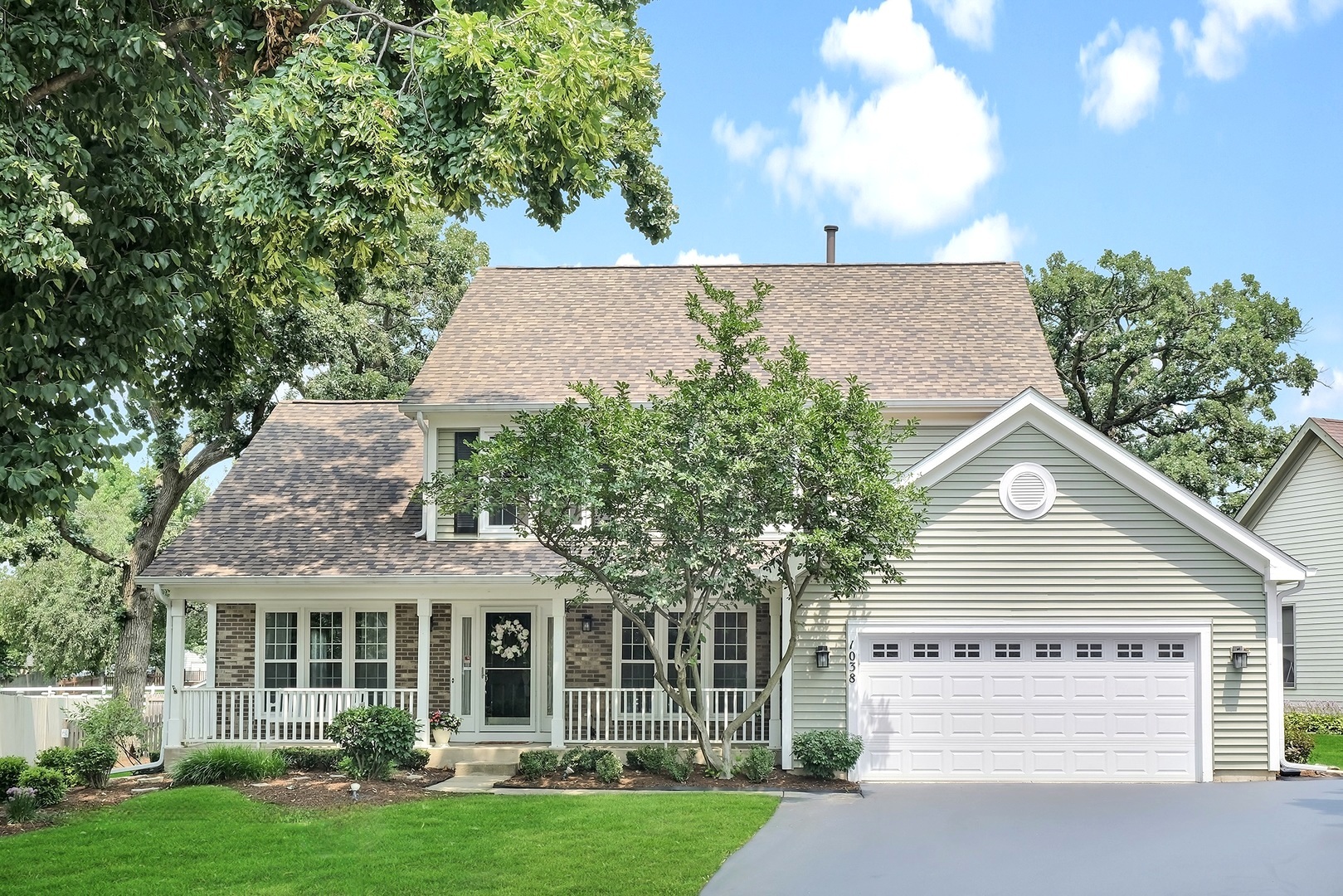 front view of a house with a yard