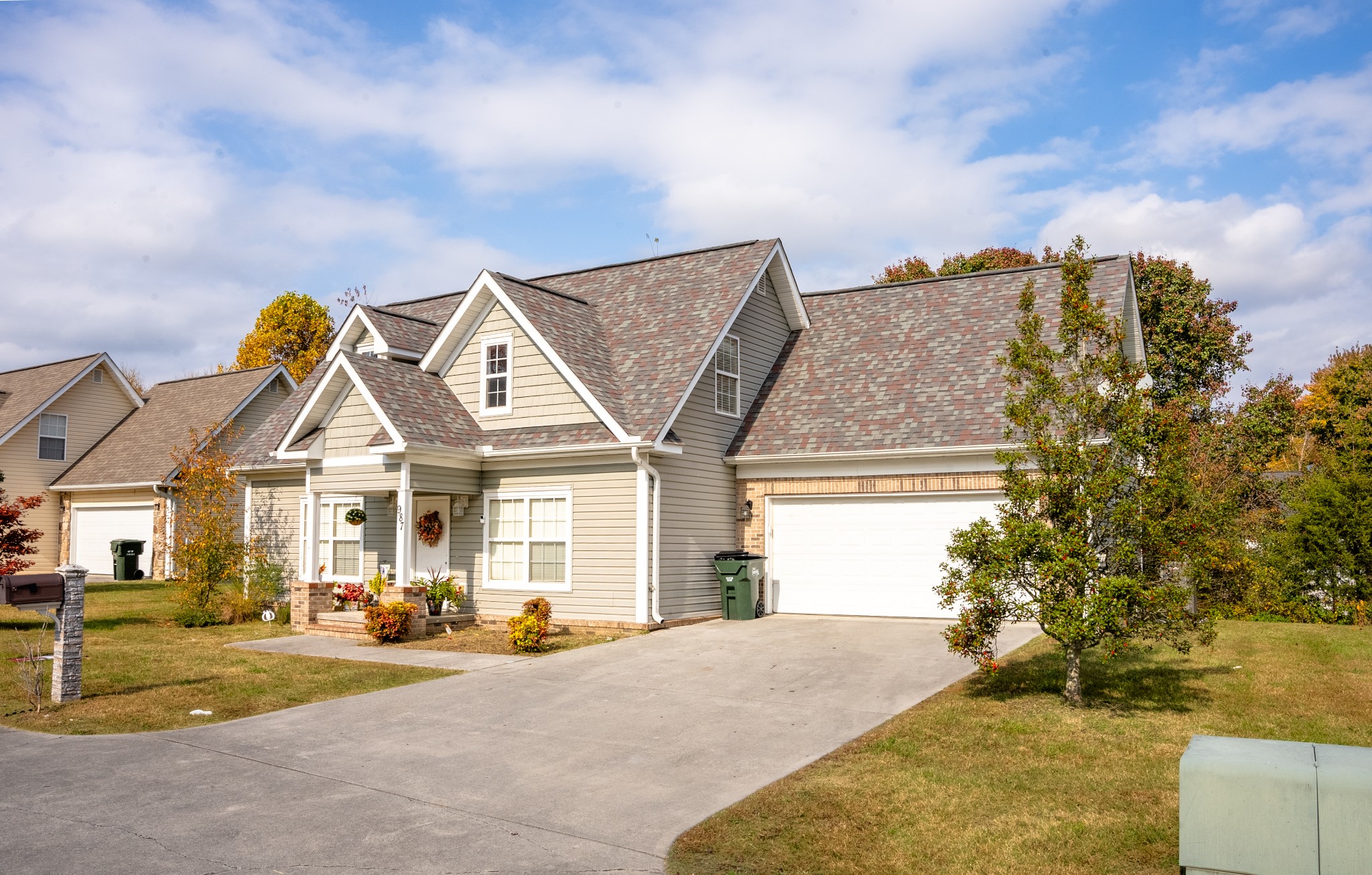 a view of a house next to a yard and road