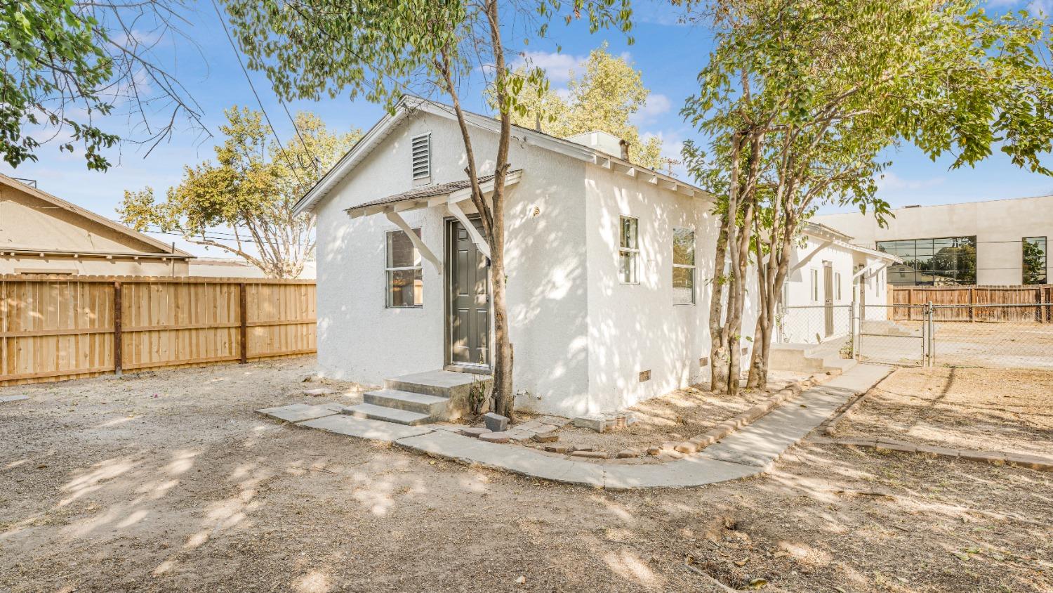 a view of a backyard of the house