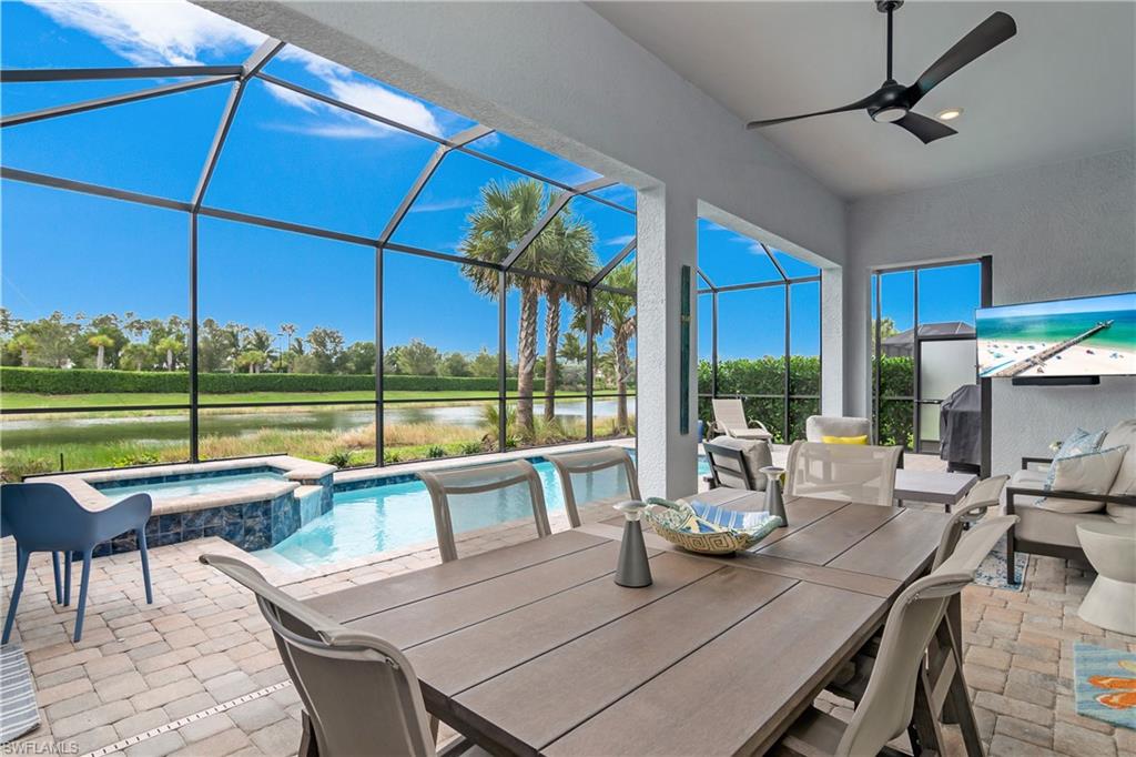 Large outdoor covered lanai space with western facing water and landscaped views.