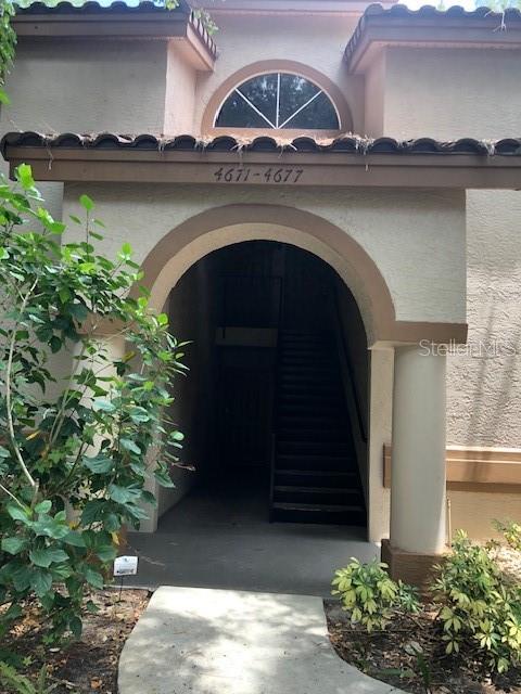 a view of front door and small yard