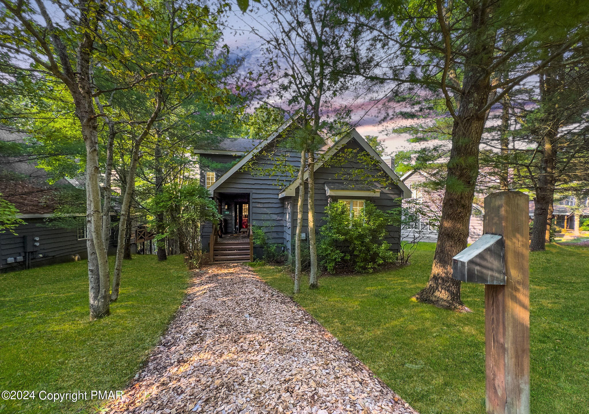 a front view of a house with garden