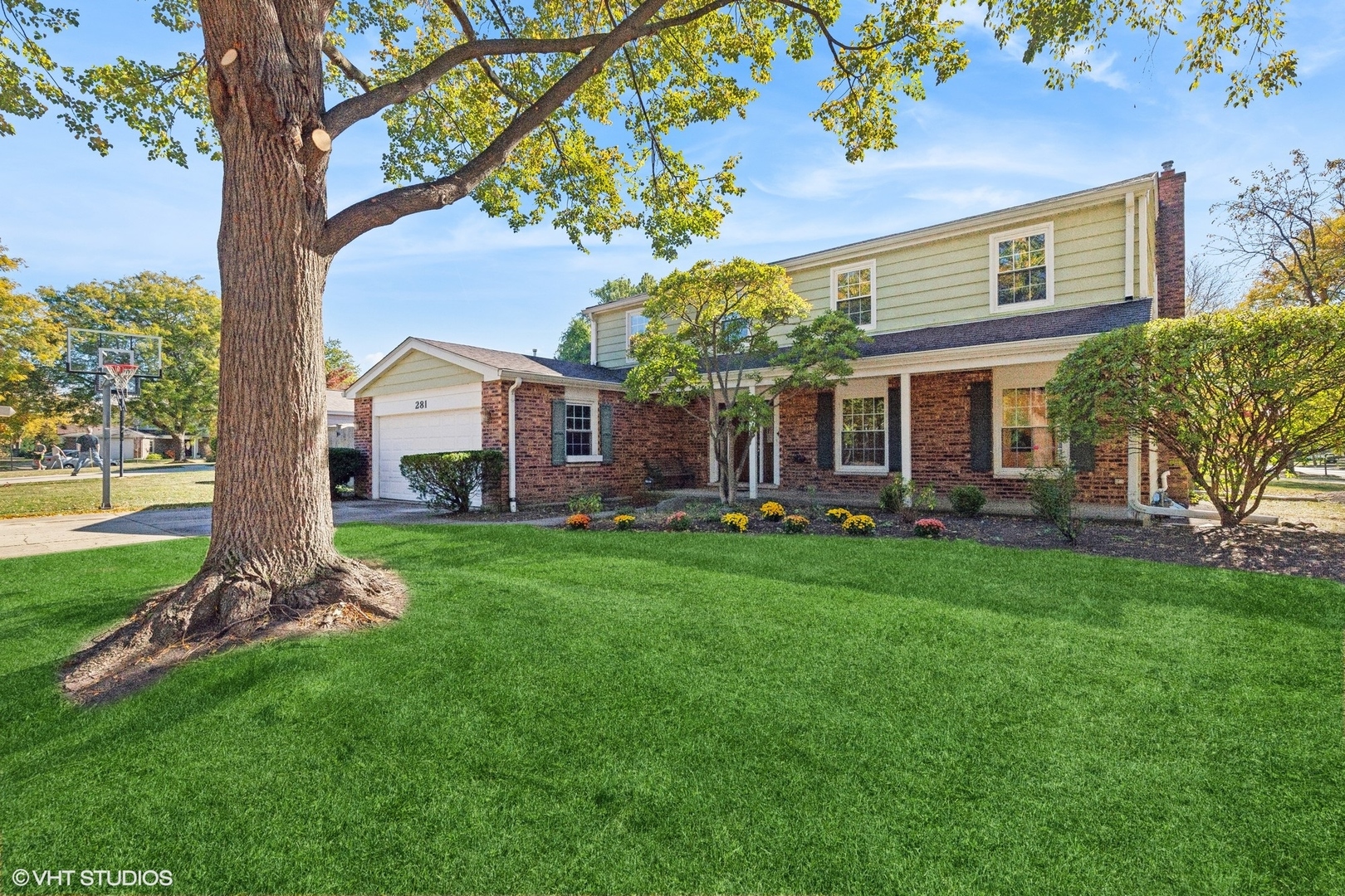 a view of a house with a backyard