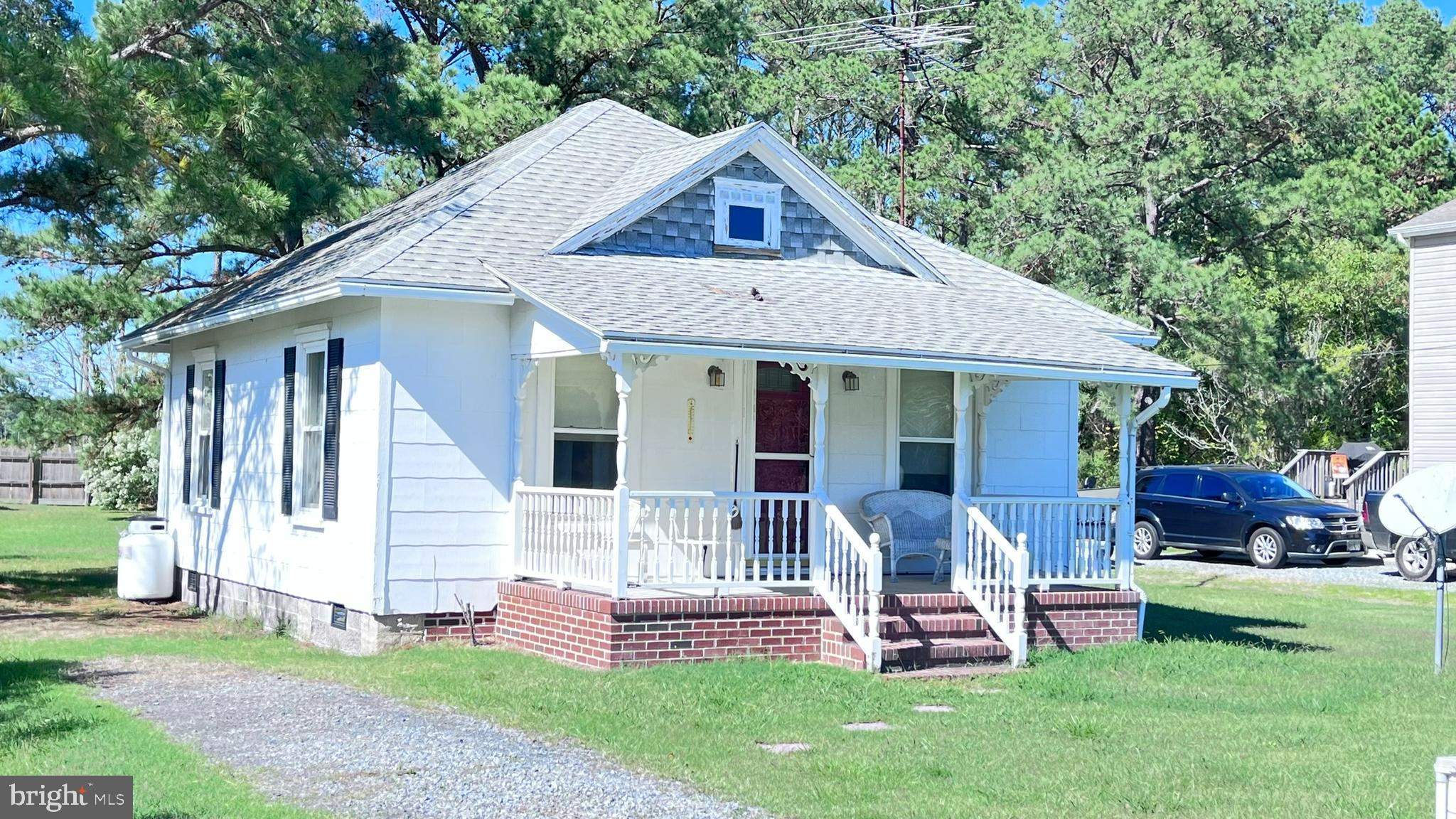 a front view of house with a garden and patio