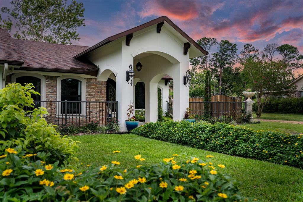 Discover this custom masterpiece accented with imported light fixtures & solid wood corbels & lovingly surrounded by meticulously designed landscaping