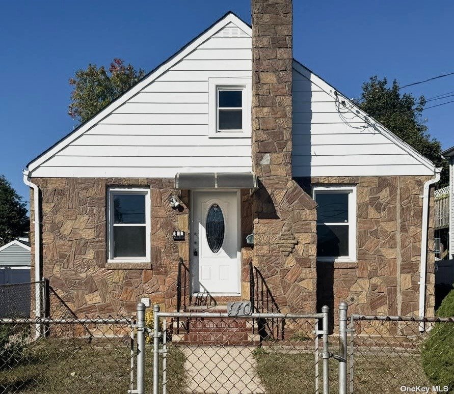 a front view of a house with glass windows