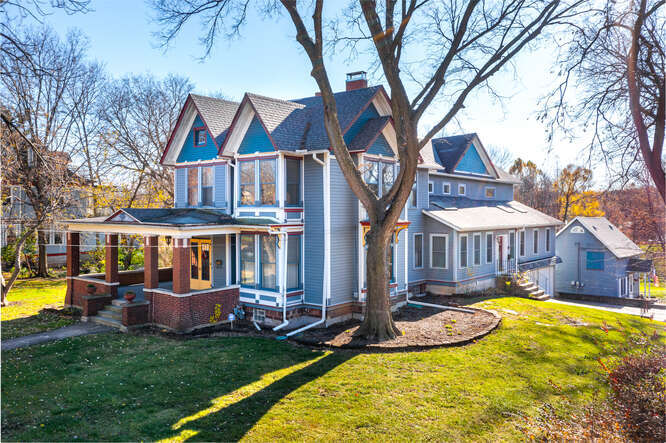 a view of a house with swimming pool and porch