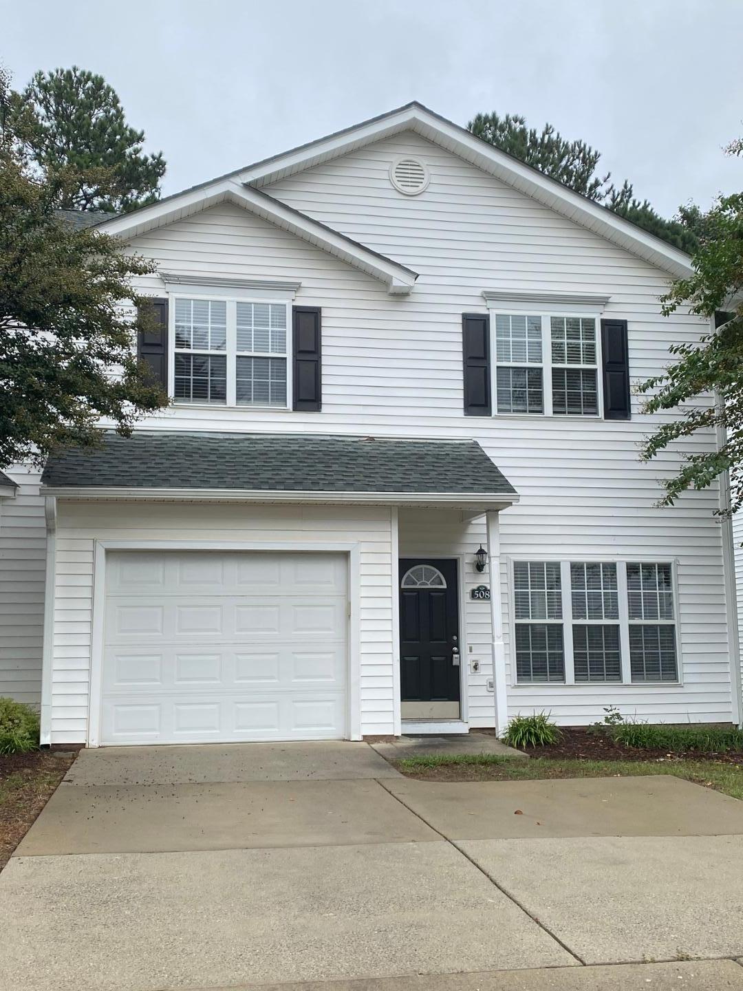 a front view of a house with a garage