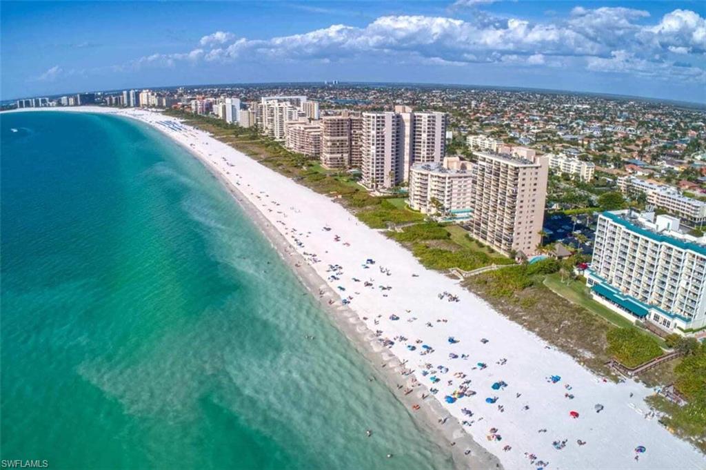 Bird's eye view with a view of the beach and a water view