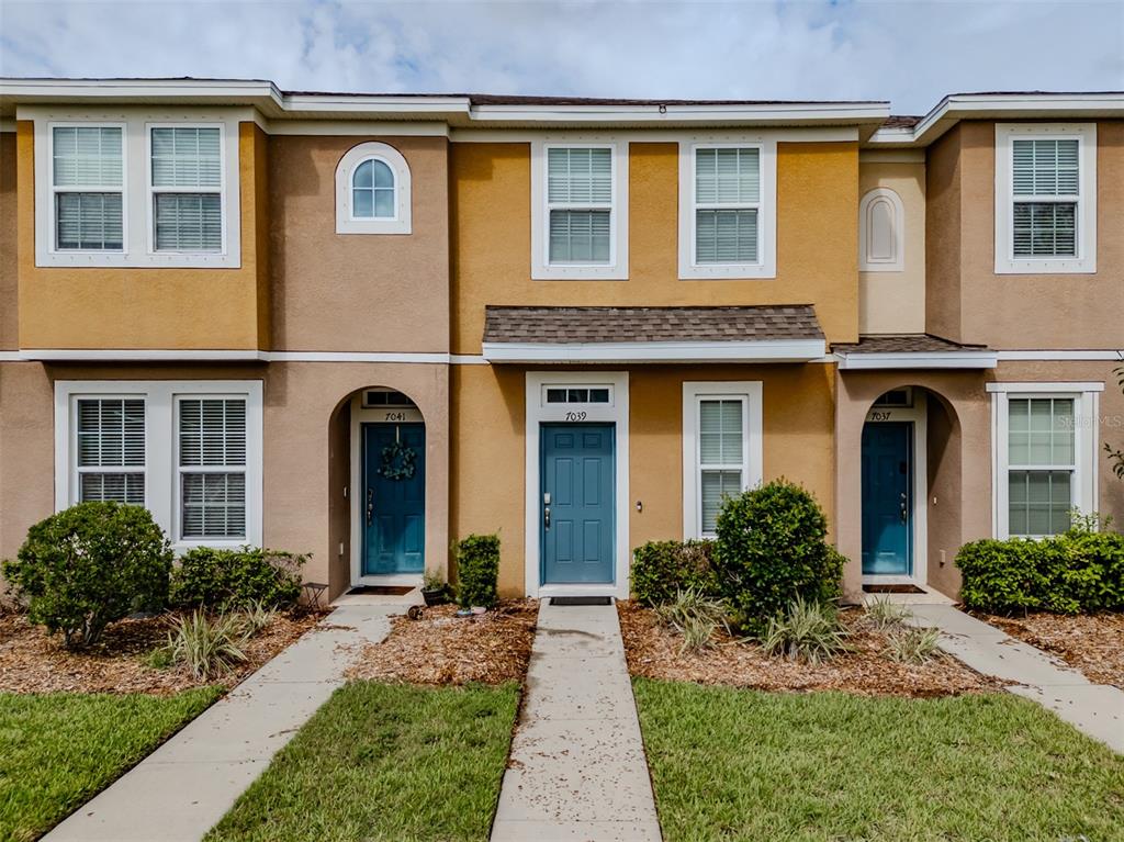 front view of a house with a yard