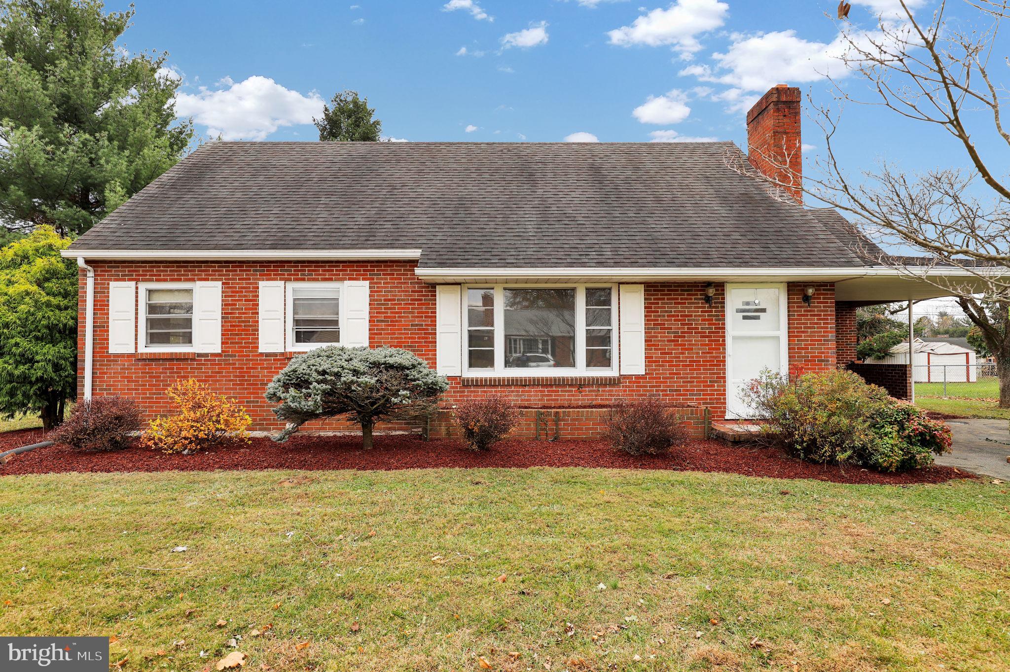 a front view of house with yard