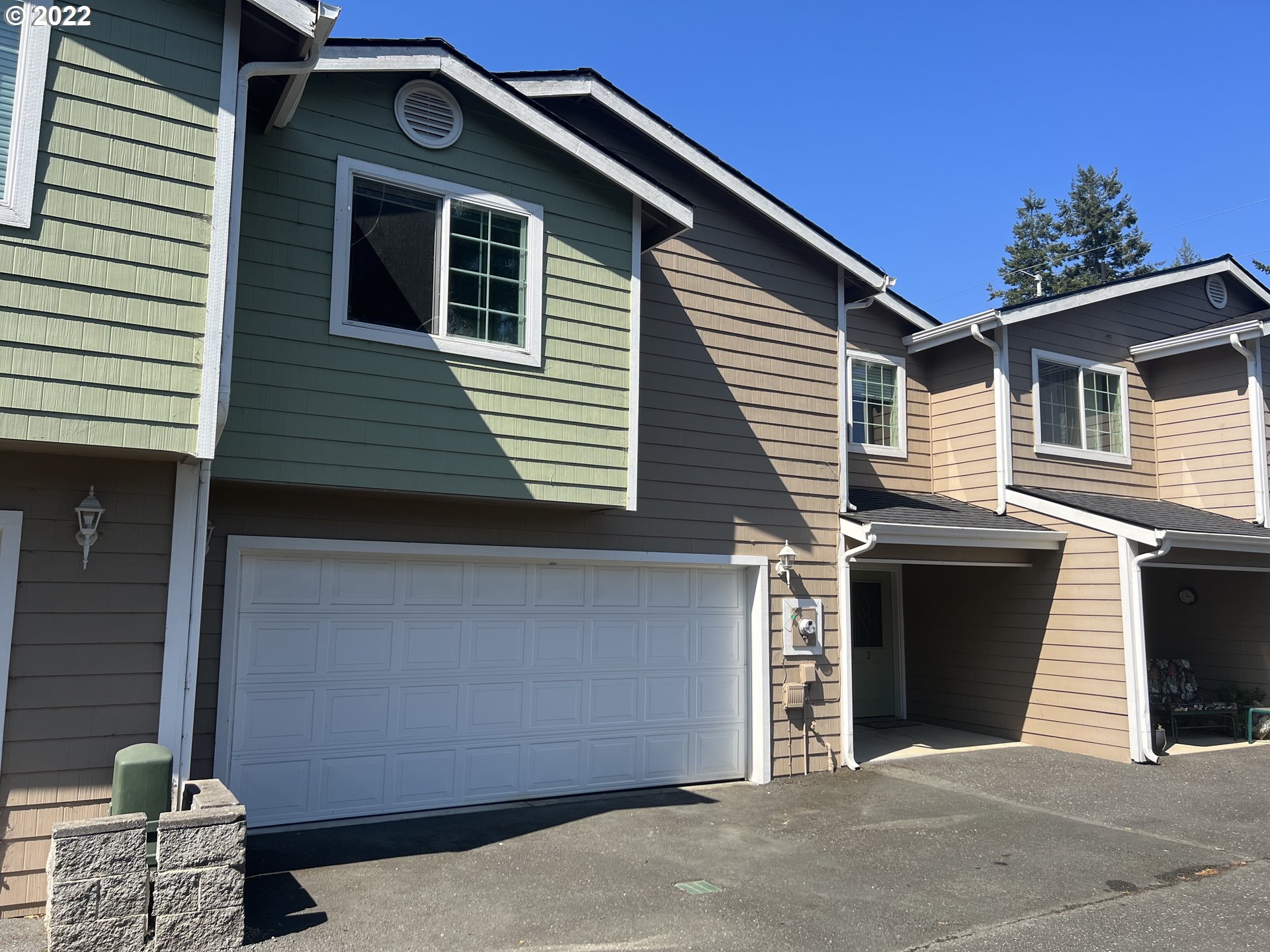 a front view of a house with a garage