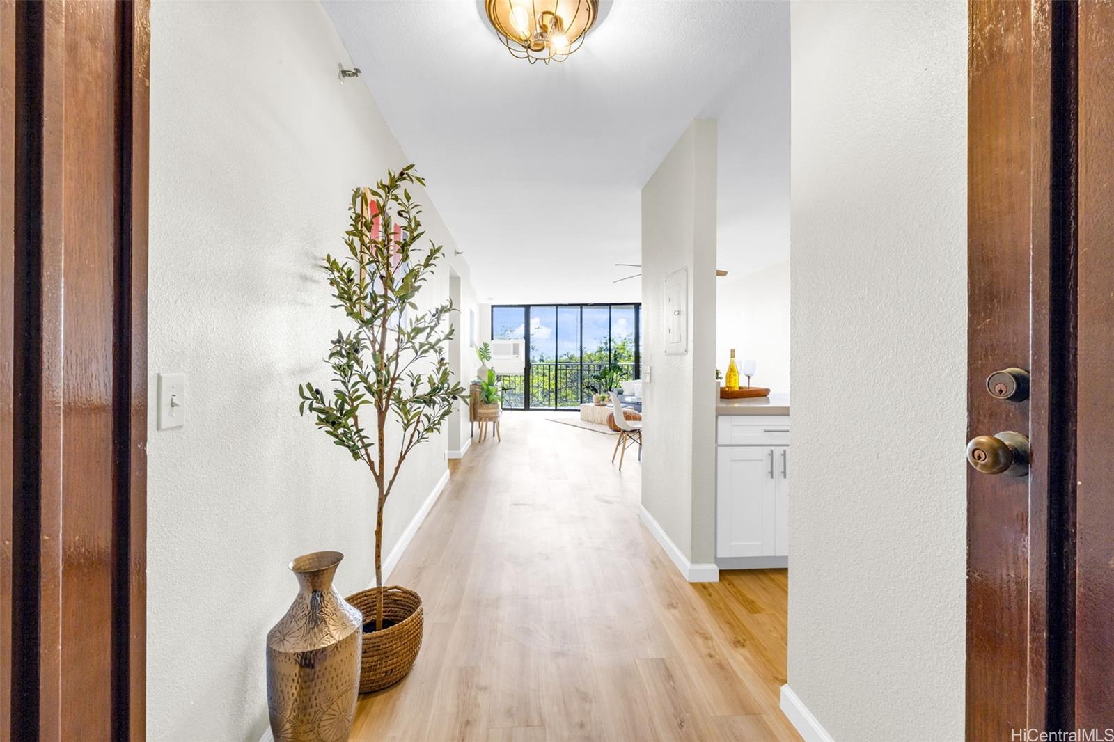 a view of entryway with wooden floor