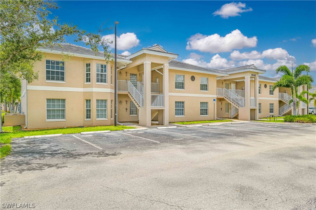 a view of a building with a yard