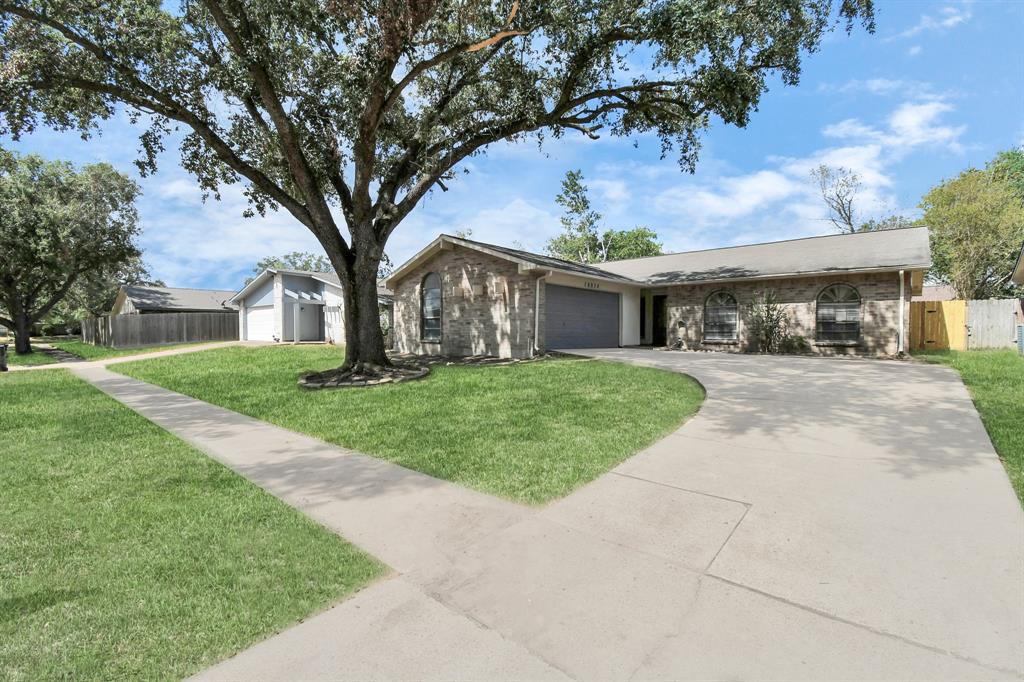 a view of house with yard and entertaining space