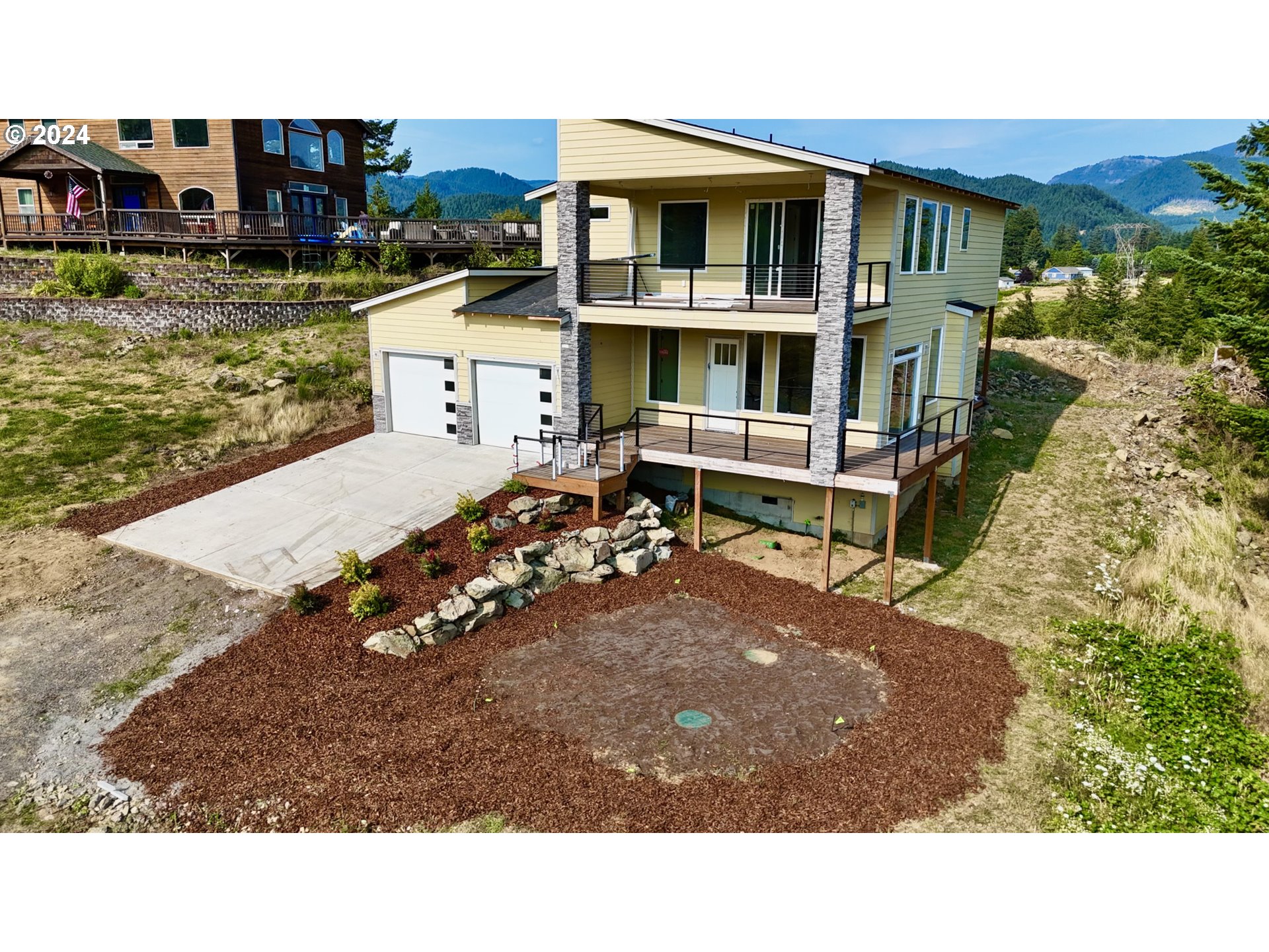 a view of a house with backyard porch and furniture