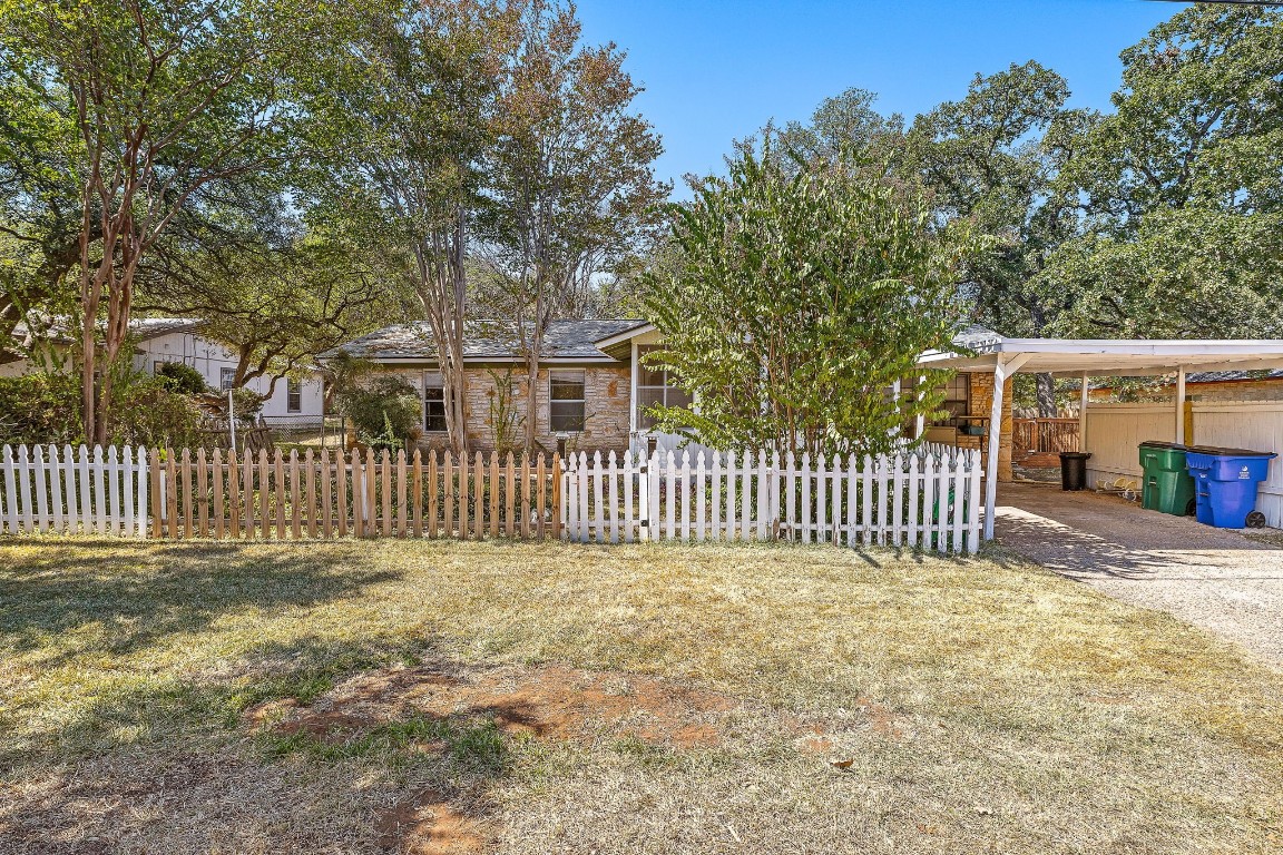 a front view of a house with a fence