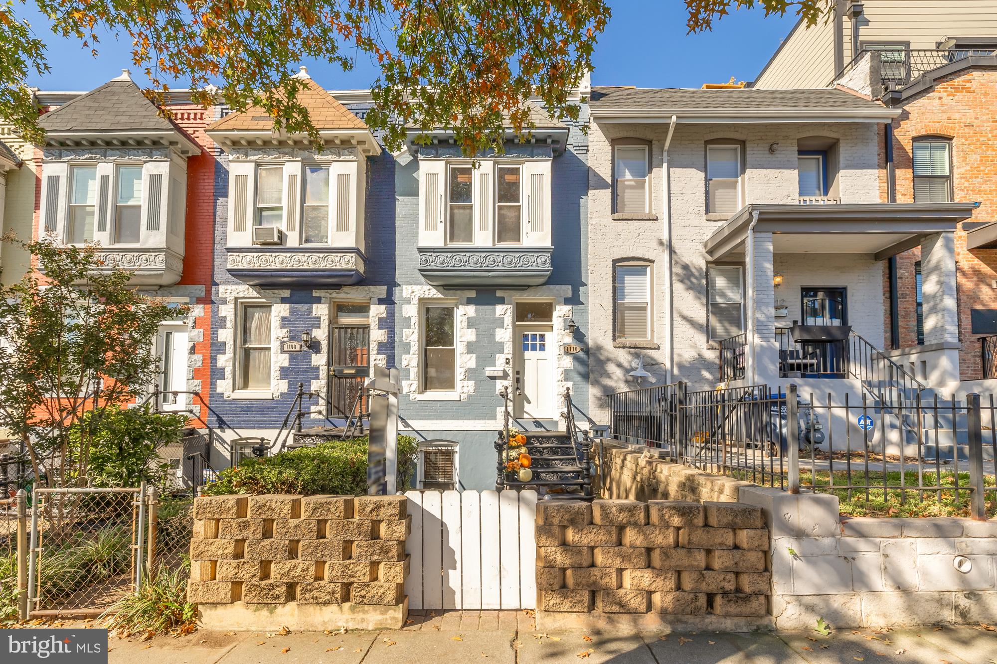 a front view of a residential apartment building with a yard