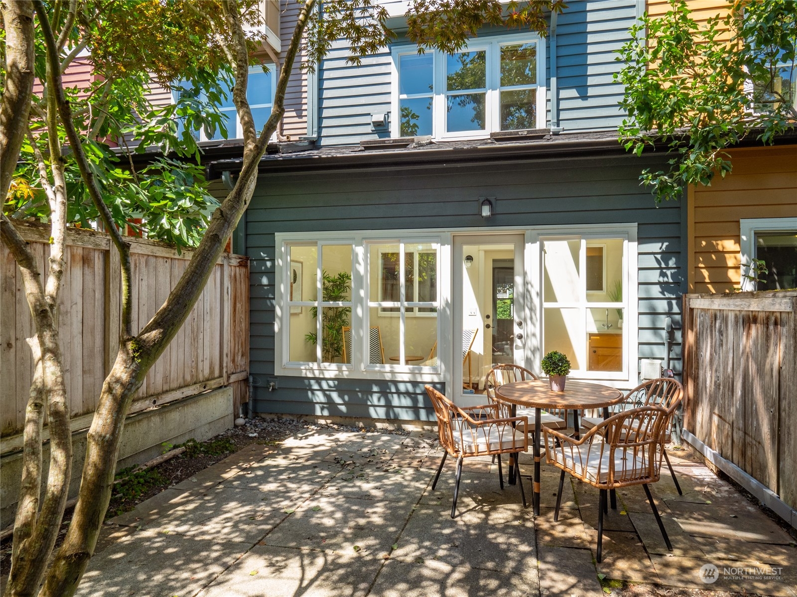 a front view of a house with table and chairs