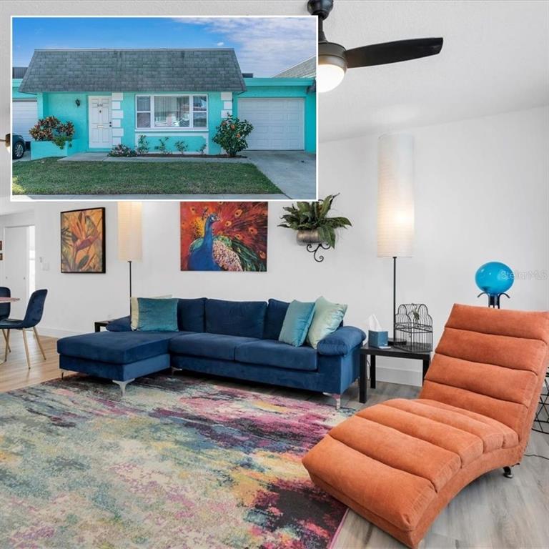 a living room with furniture and a potted plant