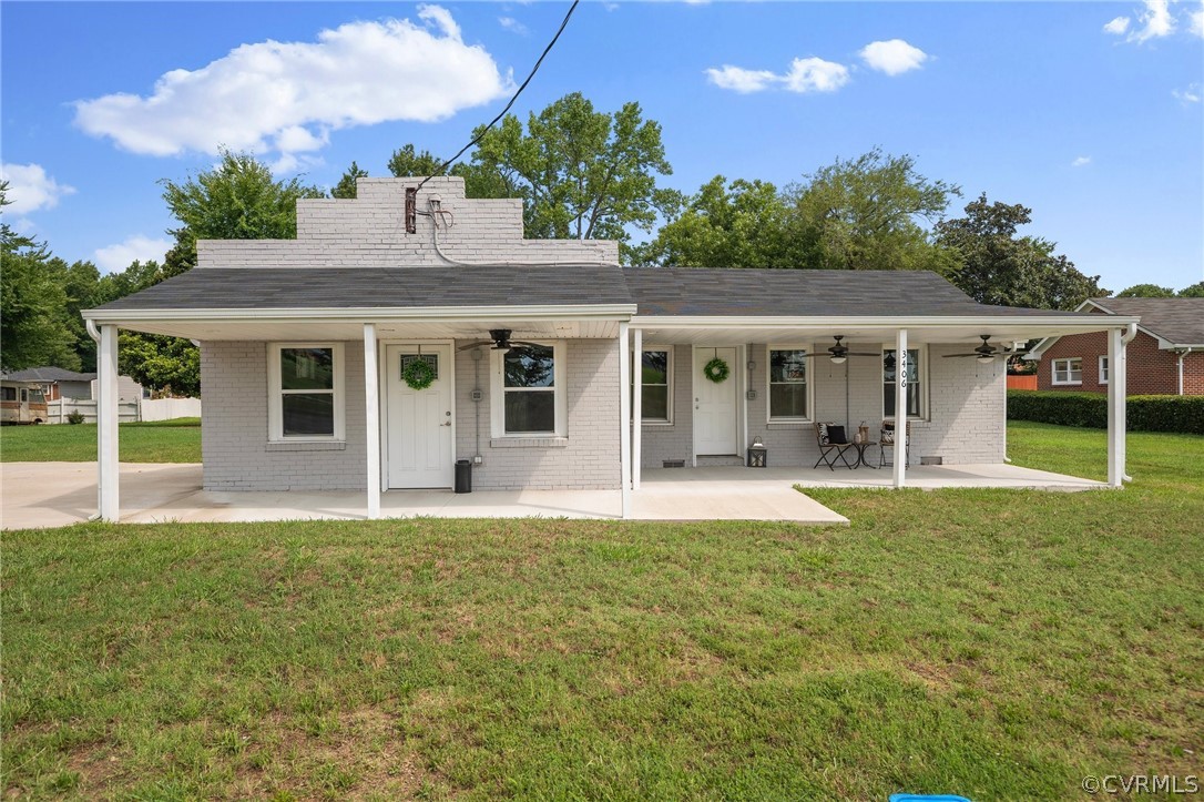 a view of a house with a yard and plants