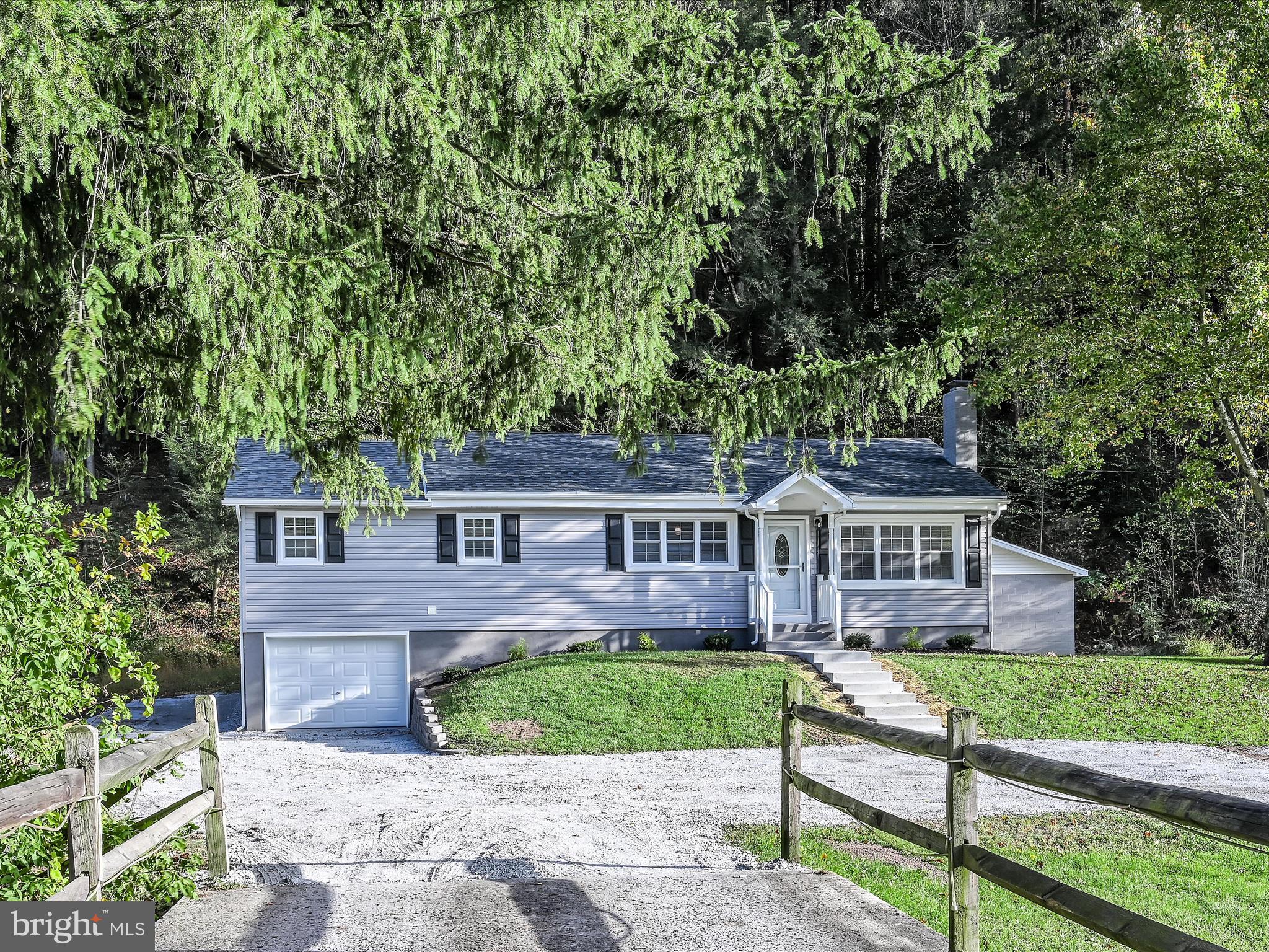 front view of a house with a yard