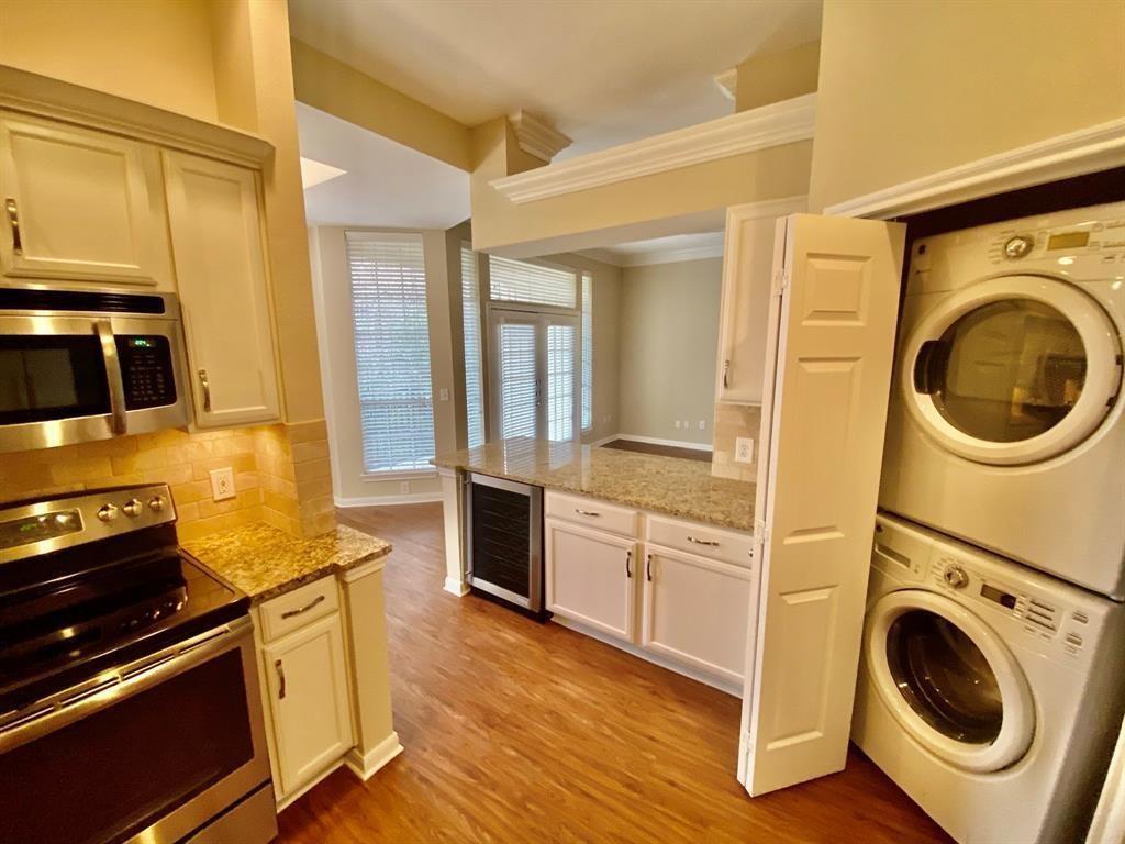 a kitchen with a stove a sink and a refrigerator