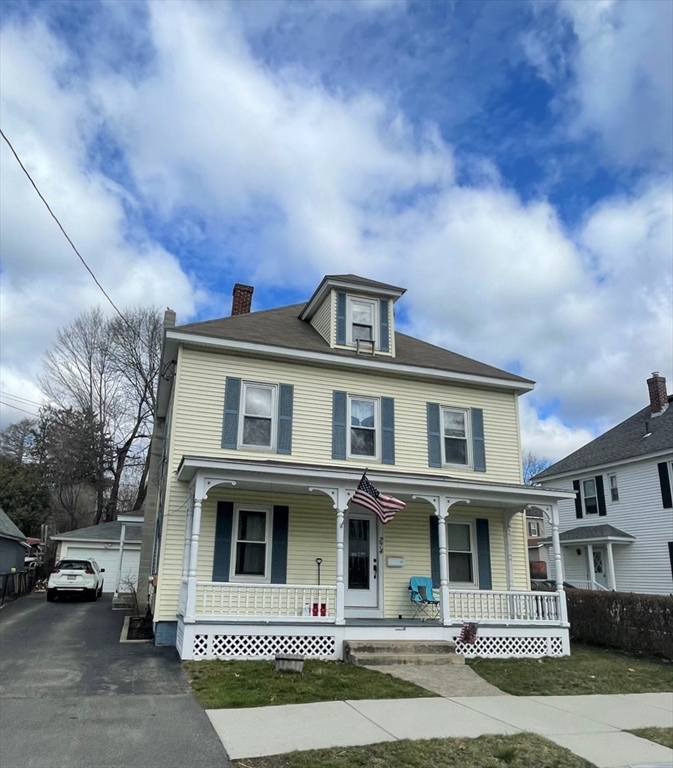 a front view of a house with garage