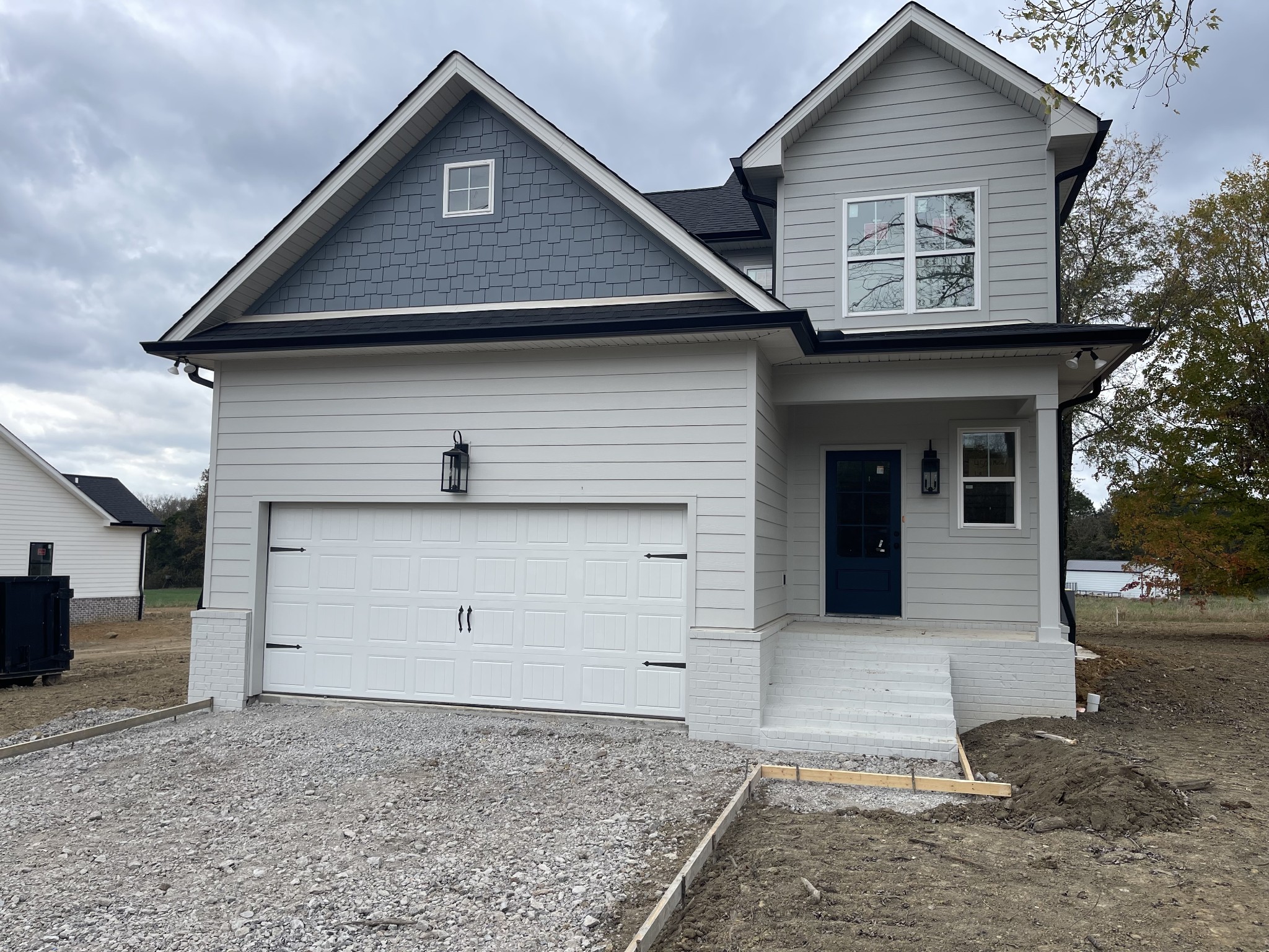 a front view of a house with a garage