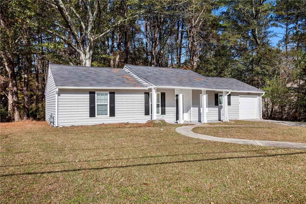 a house with trees in the background