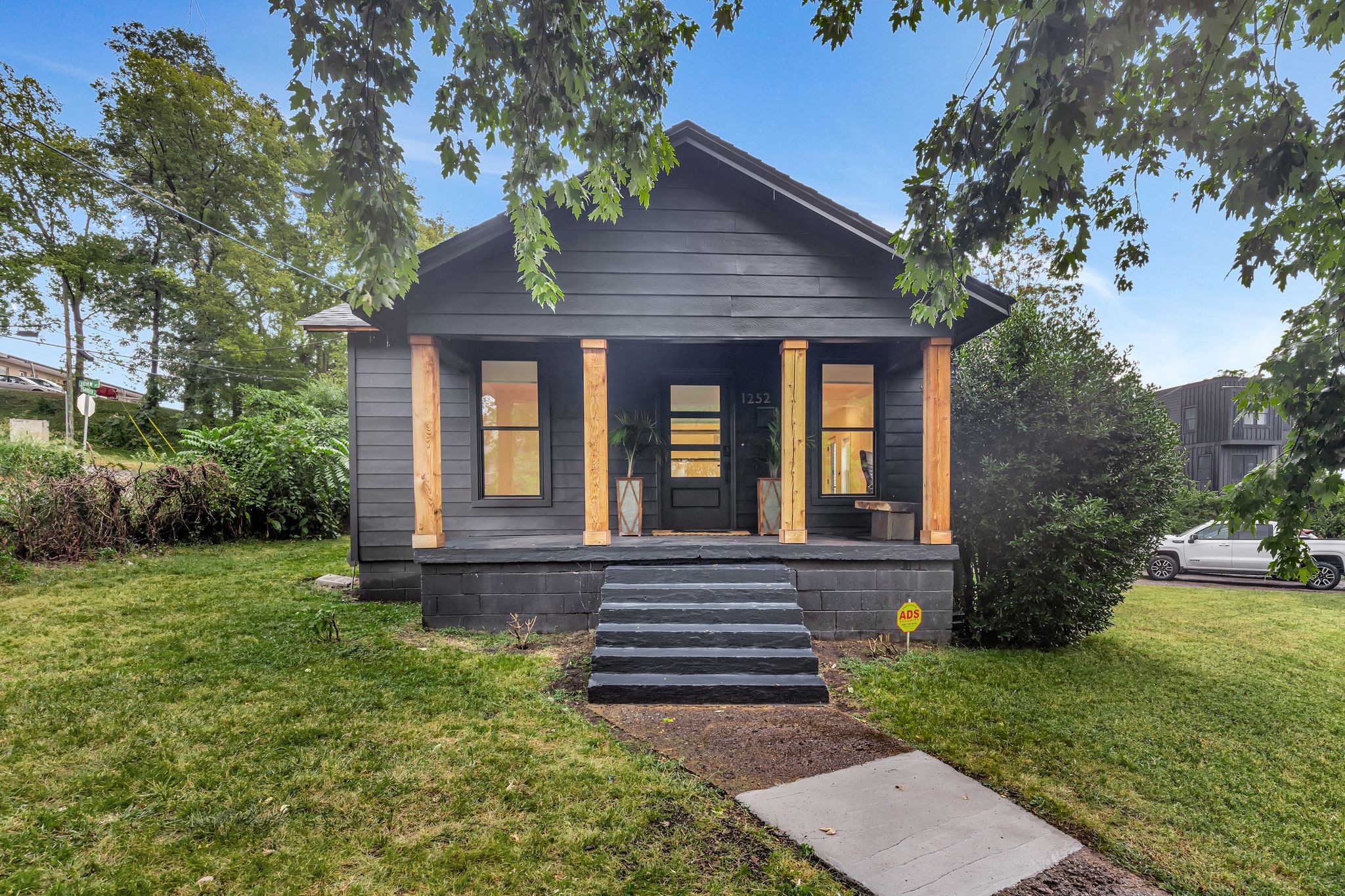 a front view of a house with garden