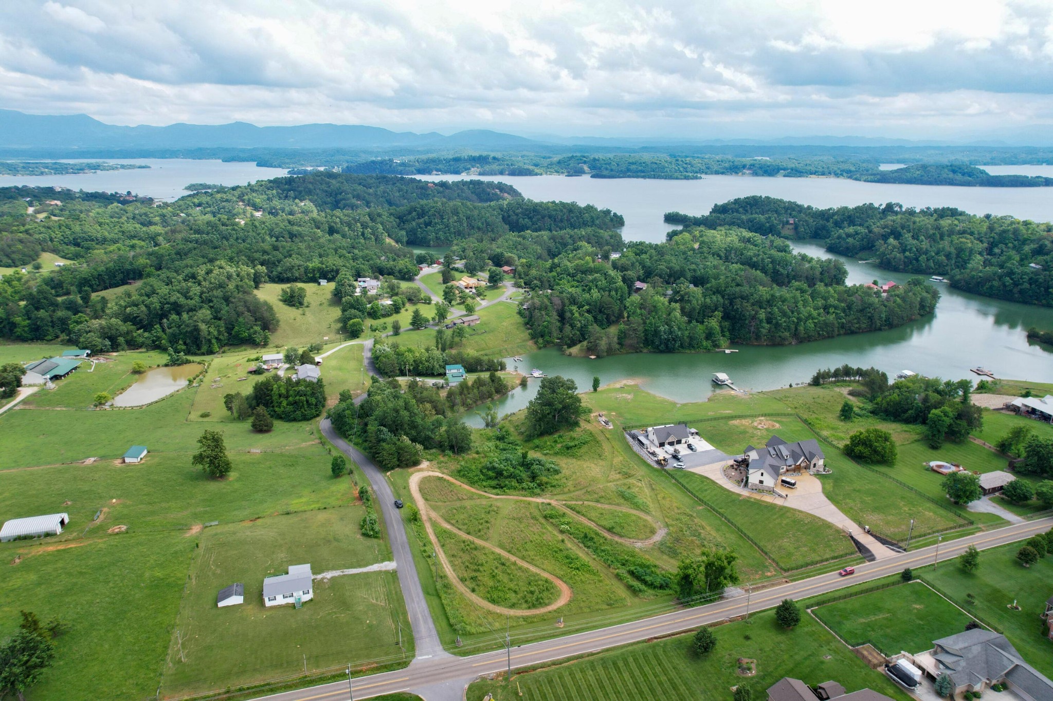 an aerial view of a golf course with lawn chairs