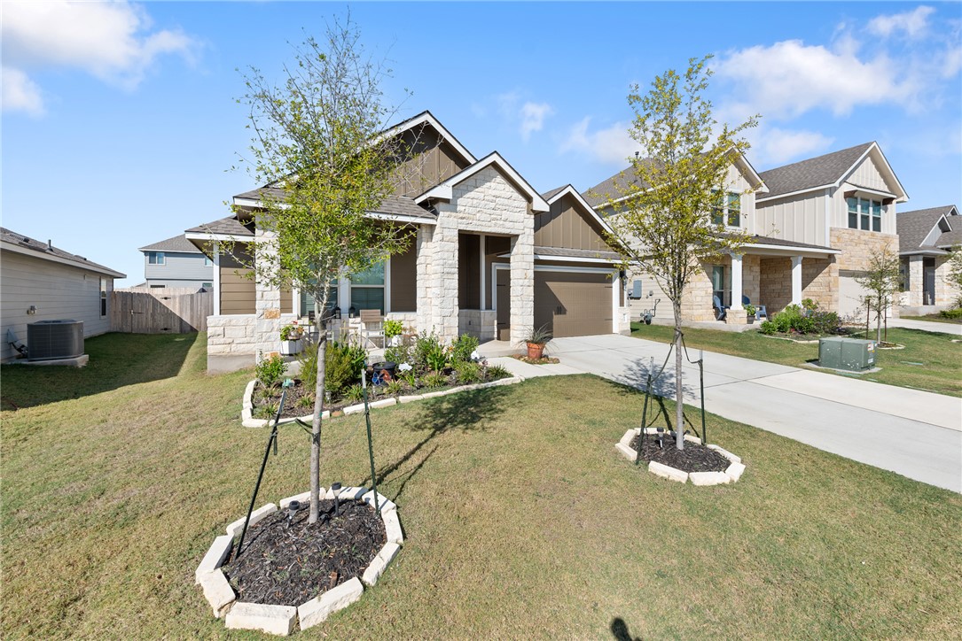 Craftsman-style house with a front lawn, central a